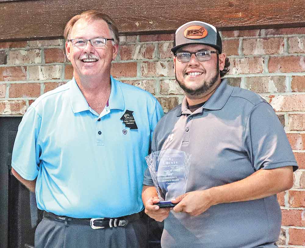 Chamber Board Chairman John Frank Clifton, above left,  presented Francisco Lopez of Corrigan, above right, with a Community Service Award from the Livingston-Polk County Chamber of Commerce Tuesday.  Photo by Emily Banks Wooten | PCE