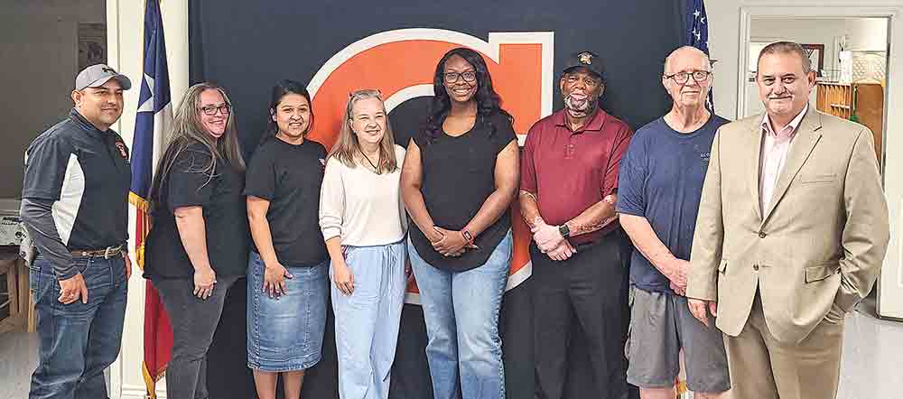 Breya Passmore is congratulated by the Goodrich ISD School Board and superintendent after being awarded the Terry scholarship.  PHOTO BY BRIAN BESCH