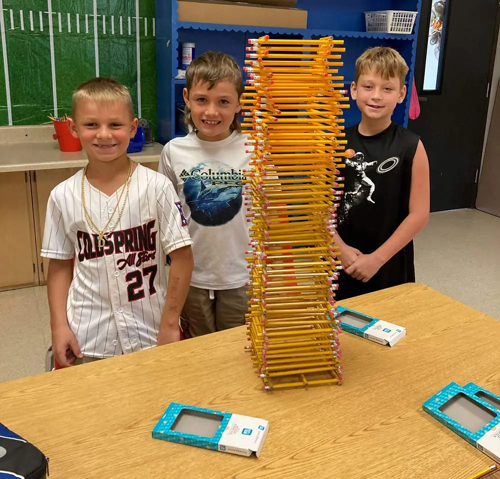 The winning team of the final Tower Project worked together to build a 37-inch tower of pencils. Shown from left are Mark Romagus, Stetson Faulkner and Landon Lane.