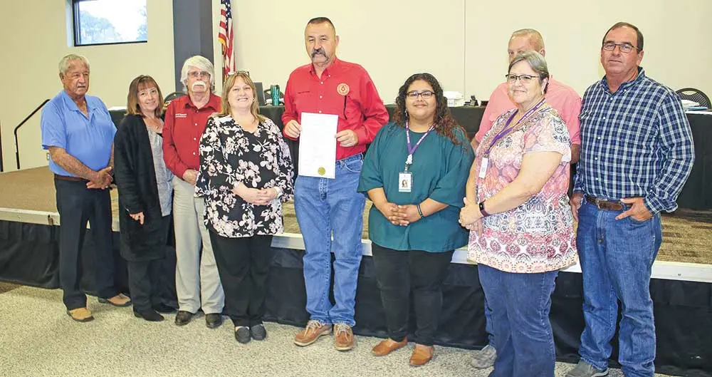 The San Jacinto County Commissioners’ Court proclaimed April as Sexual Abuse Awareness Month at its regular meeting on April 6. Assembled for the proclamation are (from left) SJ Commissioner Laddie McAnally, County Clerk Dawn Wright, Commissioner David Brandon, SAAFE House Community Relations Director Tammy Farkas, County Judge Fritz Faulkner, SAAFE House representative Carolina Mancilla, Commissioner Donnie Marrs, SAAFE House Financial Manager Twana Sullins, and Commissioner Mark Nettuno. Photo by Tony Farkas