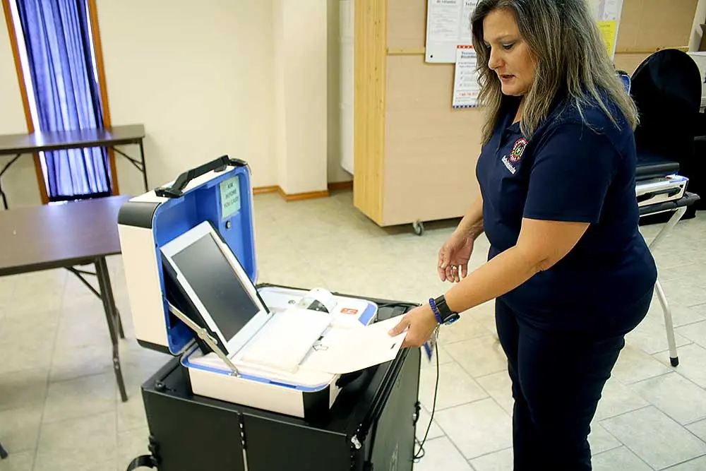 Vicki Shelley, elections administrator for San Jacinto County, provides an example of the new process for casting ballots. Photo by Tony Farkas/SJNT