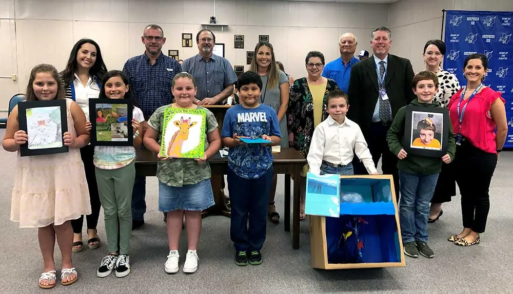 District Librarian Erin Goad, along with other members of the Shepherd School District, recognized the Shepherd Intermediate Library Art Contest winners. Students were encouraged to submit an entry — painting, writing, photograph, or a drawing — which included information about an animal. Those winners include: Third Grade, Mixed Media – Christopher Cabrera, Photography – Rylan Firmin, and Painting & Drawing – Olivia Payton; Fourth Grade, Mixed Media – Devin Wedergren, Photography – Josie Guereque, Writing – Catherine Santiago, and Painting & Drawing – Briley White; and Fifth Grade, Mixed Media – Carol Brown, Photography – Harley Newton, Writing – Kaitlyn Brown, and Painting & Drawing – Karlee McGee. (Courtesy Photo)