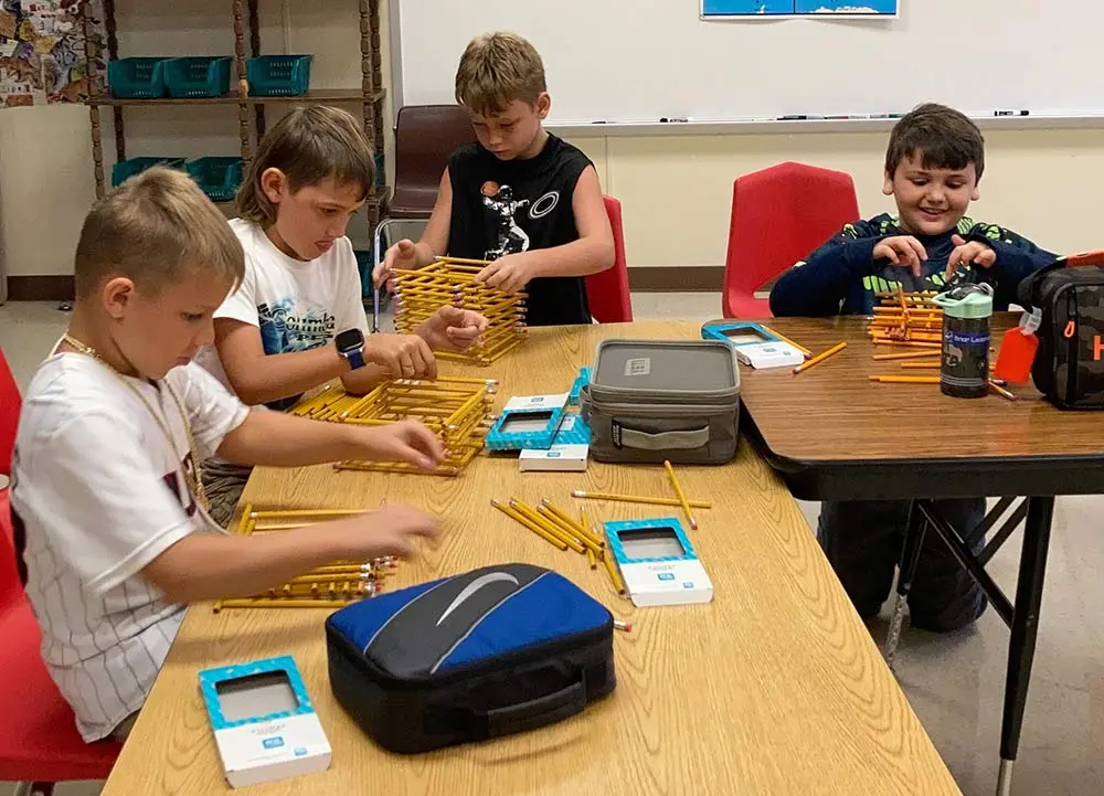 The final assignment of the Tower Project involved students working together in groups to build their own towers out of pencils using the information they had learned. Shown from left are Mark Romagus, Stetson Faulkner, Landon Lane and Briar Leasman. (Photos by Courtney Bailes)