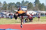 Lady Tiger Mariah Lewis on her way to a first place in the high jump. PHOTO BY BRIAN BESCH