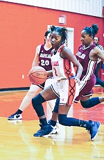 Lady Indian Bre McQueen (No. 2) looks for room during Groveton’s win over Grapeland on Dec. 17.