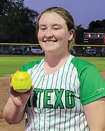 Baylee Omelina holds the home run ball she hit over center field against Grapeland. COURTESY PHOTO