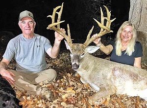 Shanda and Rodney Moore display the impressive Trinity County bruiser the lady hunter brought down on the afternoon of November 4. The 6 1/2-year-old 21-pointer registers official TBGA scores of 185 7/8 gross and 175 6/8 net. It’s among the biggest whitetails ever killed by a lady hunter in the Pineywoods.  Courtesy photo Rodney Moore