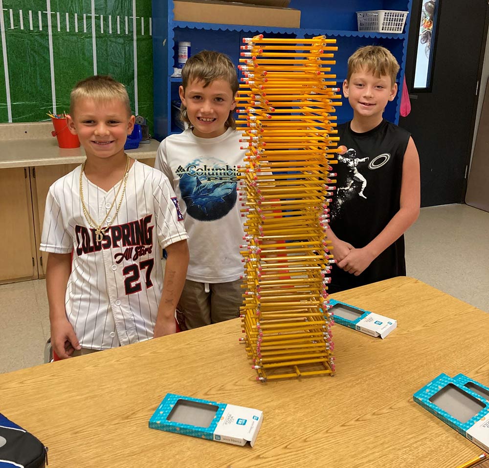 The winning team of the final Tower Project worked together to build a 37-inch tower of pencils. Shown from left are Mark Romagus, Stetson Faulkner and Landon Lane.