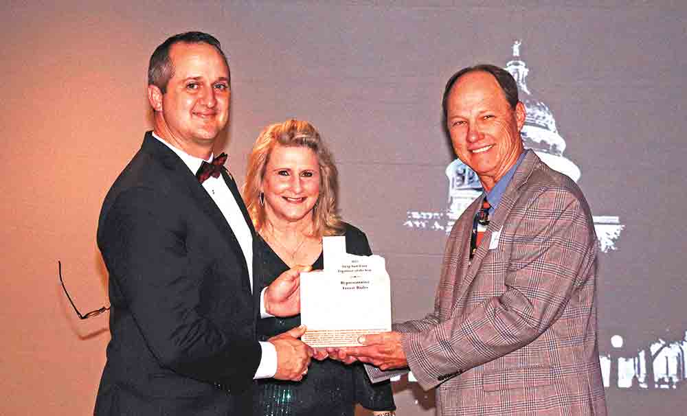 District 18 Rep. Ernest Bailes (left) accepts Legislator of the Year Award from Deep East Texas Council of Governments (DETCOG) President, Shelby County Judge Allison Harbison (center) and DETCOG President-Elect San Augustine County Judge Jeff Boyd (right) at the Deep East Texas Reception in Austin. Courtesy photo