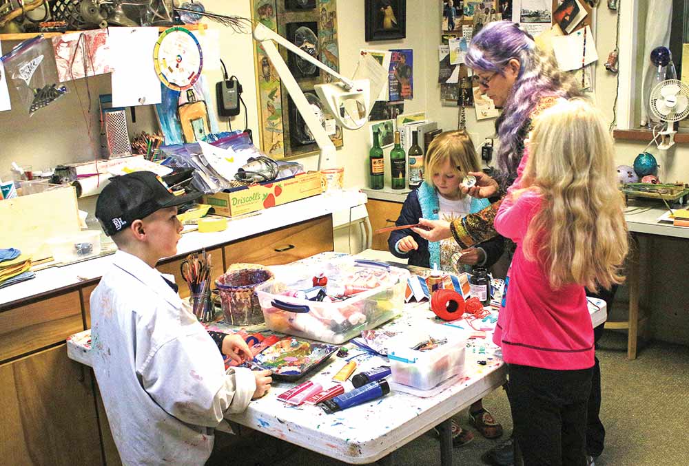  Tish Inman helps her class in their various art projects. Inman offers art scholarships for 20 Groveton students a year.   Photos by Tony Farkas | TCNS