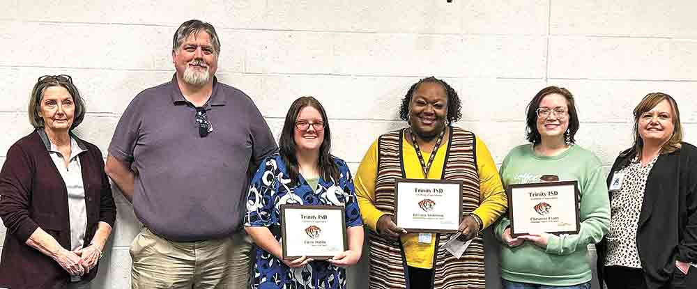 The Trinity School Board honored employees of the month Cheyanne Evans, professional; Leivaca Anderson, paraprofessional; and Cassie Stubbs, support staff. Pictured are (from left) Board member Judy Bishop, Technology Director Barry Coleman, Cassie Stubbs, Leivaca Anderson, Cheyanne Evans, and Brittaney Cassidy, High School Principal. 