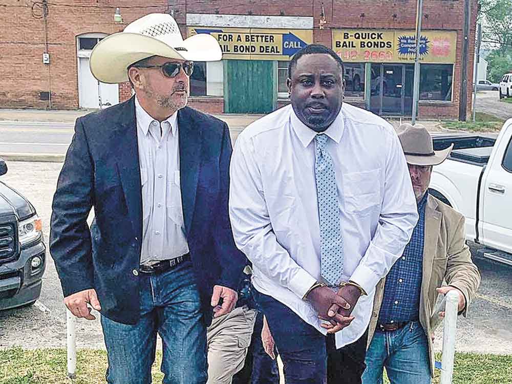 Trinity County Sheriff Woody Wallace (left) and other law enforcement officials escort Tivirus Craft, 42, following his conviction and sentencing for the October 2019 death of Wesley Dykes. Courtesy photo