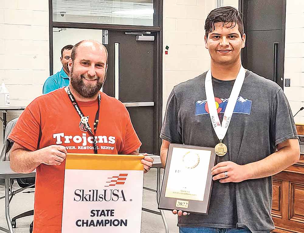 Culinary Arts Instructor Chef Joel Casiday presented COHS senior Ethan Manshack and commended him for winning the SkillsUSA state championship in the Restaurant Services category at the COCISD Board of Trustees meeting on April 25. Courtesy photo