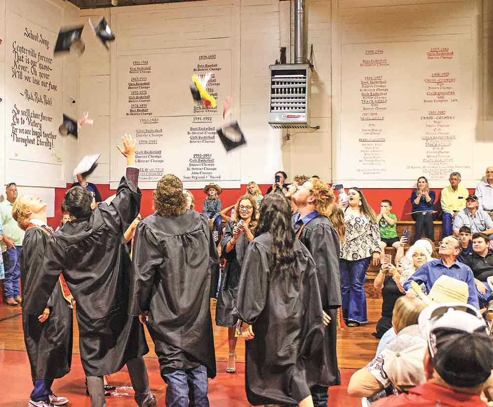 The graduates of Centerville gather for the traditional mortar board toss. Photo by Tony Farkas