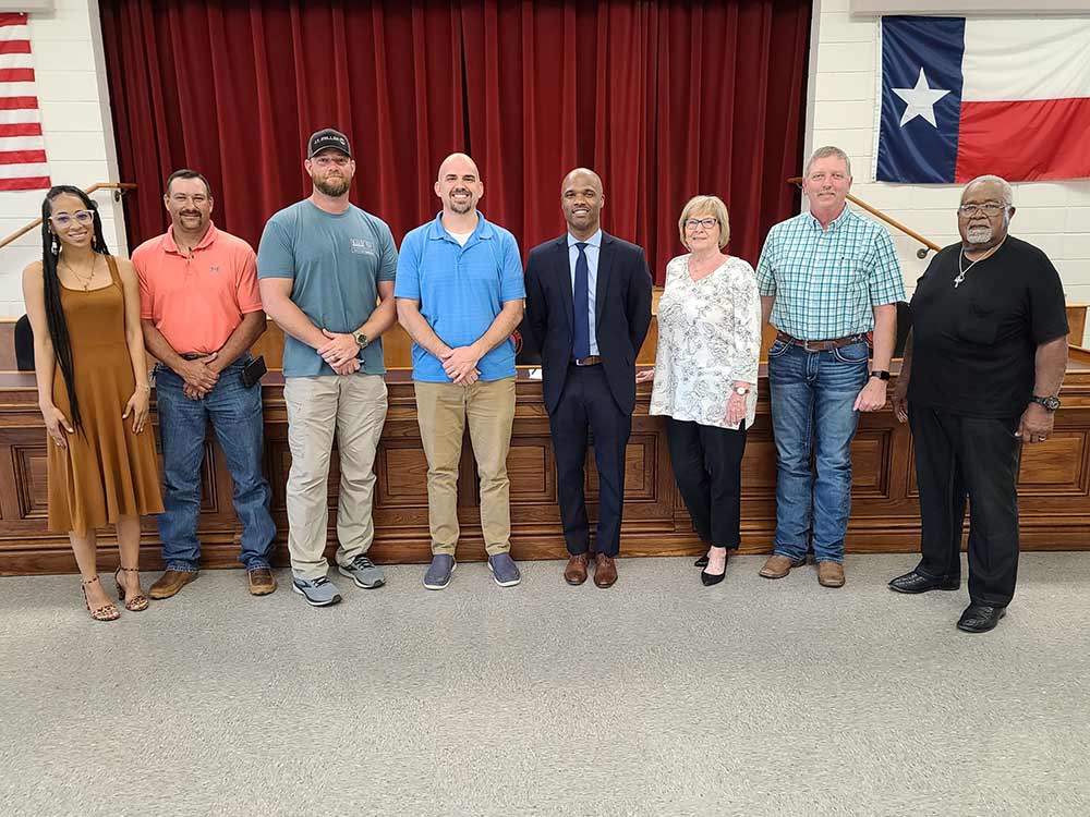 Cassie Gregory The COCISD Board of Trustees voted to officially hire Dr. Bryan Taulton as Superintendent of Schools on Thursday. Shown are (from left) Trustee Ashney Shelly, Trustee William Baker, Board Vice President Daniel Williams, Board President Paul Buchanan, Superintendent Dr. Bryan Taulton, Trustee Barbara Moore, Board Secretary Tony Sewell and Trustee Berlin Bradford. (Courtesy Photo)