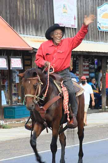 Clearly enjoying the ride, 72-year-old Marshall Roberts rides in the annual SJC Fair and Rodeo parade.