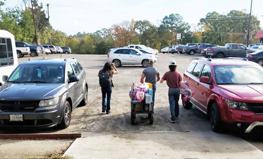 A customer is helped out to the parking lot after shopping for gifts at the Center of Hope’s Empty Stocking Program.