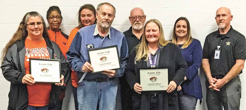 Trinity ISD honored its employees of the Month Kara Huffman, Craig Troutman and Amanda Schubert at its recent meeting. Pictured are (from left) Paraprofessional Kara Huffman, Board Secretary Dorothy Franklin, Maintenance Director Gillian Campbell, Transportation Director Craig Troutman, John Foreman, LES Principal Kelli Robinson and TMS Principal Kent Copley. Courtesy photo