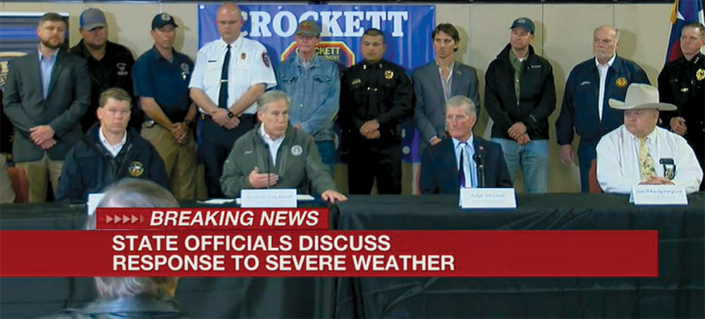 Gov. Greg Abbott holds a press conference at the Crockett Civic Center. Picture captured from live broadcast by Jan White