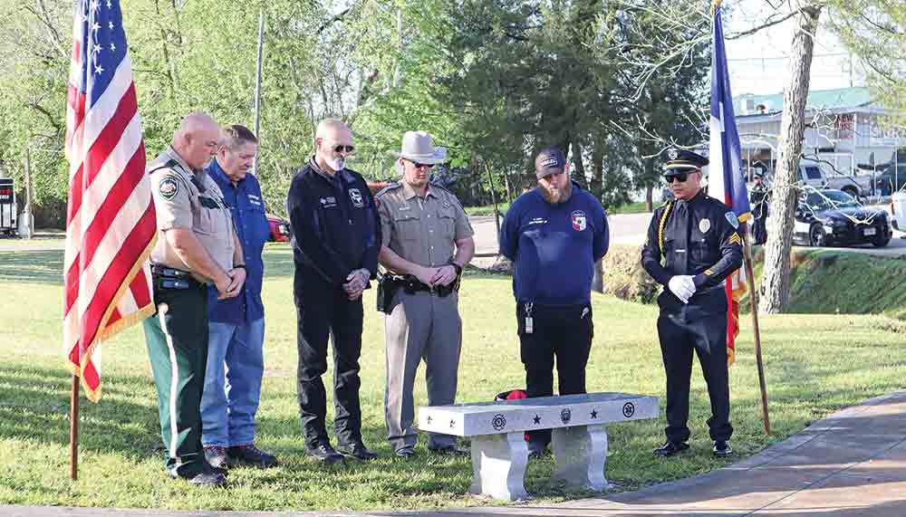 Sergeant Glenn Edwards of the Polk County Sheriff’s Office, John Haynes of the Livingston Volunteer Fire Department, Ricky Taylor of Texan EMS, Sergeant Sammy Lattner of the Texas Department of Public Safety, C. Lacy of Allegiance EMS and Sergeant Tito Reyes of the Livingston Police Department view the first responders bench they just unveiled. Photo by Emily Banks Wooten