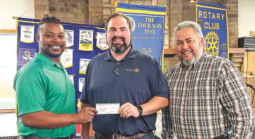 Andrew Boyce, president of the Rotary Club of Livingston, presents a donation to Brandon Reece and Steve Davidson for the Boys & Girls Club of Polk County. Reece serves as the program director for the Boys & Girls Club of Polk County’s facility on Liberty Avenue and Davidson serves as president and CEO of Boys & Girls Clubs of Deep East Texas. (l-r) Reece, Boyce and Davidson. Photo by Emily Banks Wooten