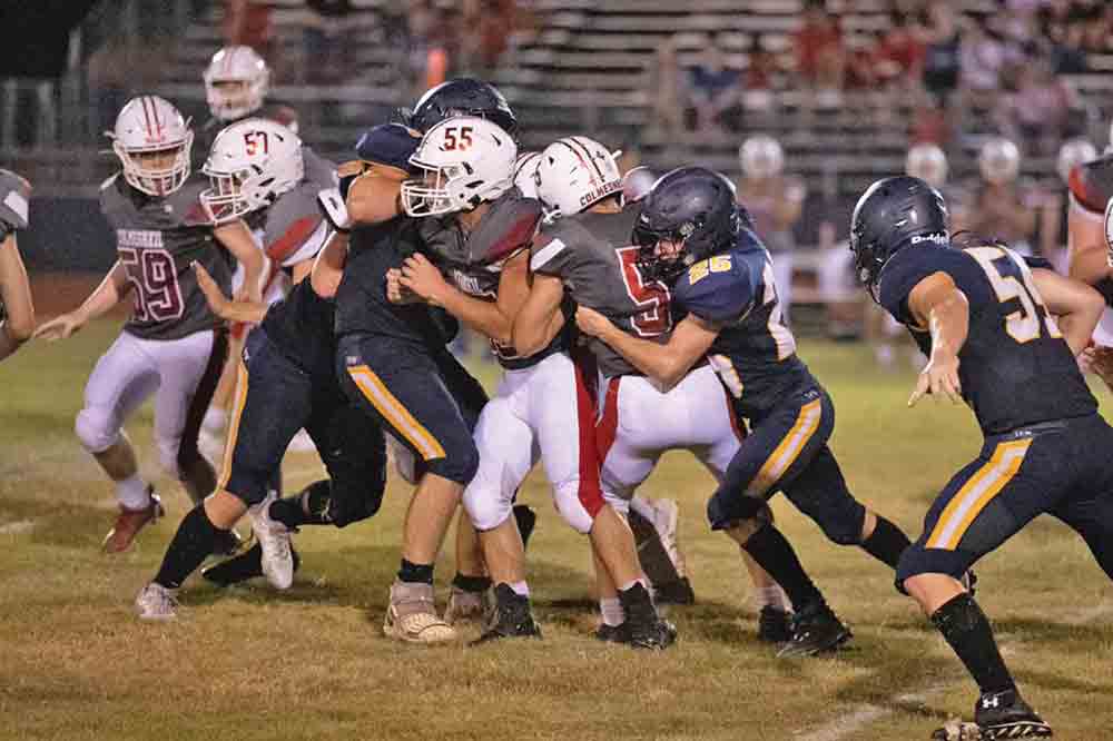 The Colmesneil Bulldogs make their way down the field against West Hardin last Friday night