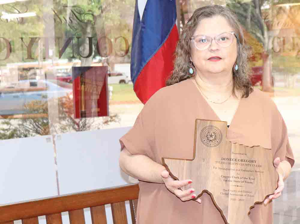 Tyler County Clerk Donece Gregory is shown with her award for being named “County Clerk of the Year” for the whole state from the County and District Clerks’ Association of Texas. CHRIS EDWARDS | TCB
