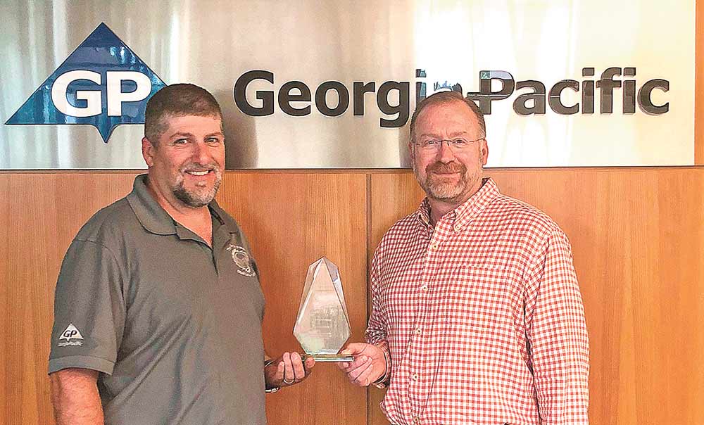 Georgia-Pacific’s Diboll Lumber and Diboll Particleboard have been awarded the Resiliency Award for conserv-ing energy to help protect the Texas grid during last year’s winter storm. Accepting the award on behalf of Geor-gia-Pacific are (from left to right) Danny Wright, Diboll Lumber Plant Manager; and Pat Aldred, Vice-President of Composite Panels. Courtesy photo