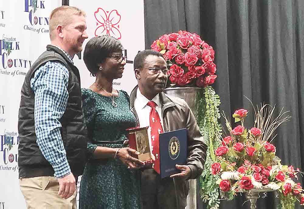 2022 Chamber Board Chairman Craig Jones presented the Outstanding Polk County Citizens of the Year award to Dr. Joseph Goin M.D. and Ms. Angela Goin Ph.D. at the 87th annual awards ceremony of the Livingston-Polk County Chamber of Commerce Thursday. Photo by  Brian Besch