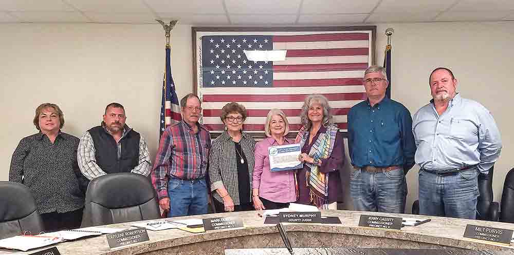 The Polk County Commissioners Court issued a proclamation recognizing Soil and Water Stewardship Conservation Week during its regular meeting Tuesday. Accepting the proclamation were members of the Polk-San Jacinto Soil and Water Conservation District. (l-r) Precinct 1 Commissioner Guylene Robertson, Precinct 2 Commissioner Mark Dubose, Wright Baker, Patricia Snook, Sandy Baker, County Judge Sydney Murphy, Precinct 4 Commissioner Jerry Cassity and Precinct 3 Commissioner Milt Purvis. Photo by Emily Banks Wooten