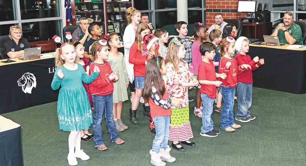 Creekside Elementary first and second grade student council members entertained the board with musical selections. Courtesy photo