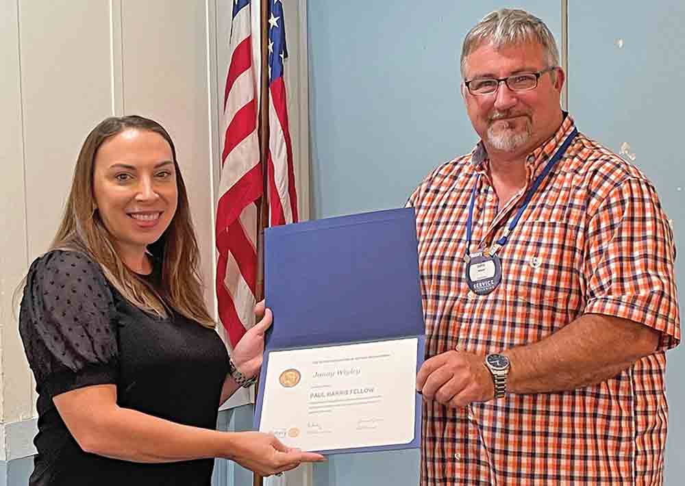 Woodville ISD faculty member and Interact Club sponsor Janay Wigley (pictured left) was presented with a Paul Harris Fellow award from Rotary Club of Woodville president John WIlson. MOLLIE LA SALLE | TCB