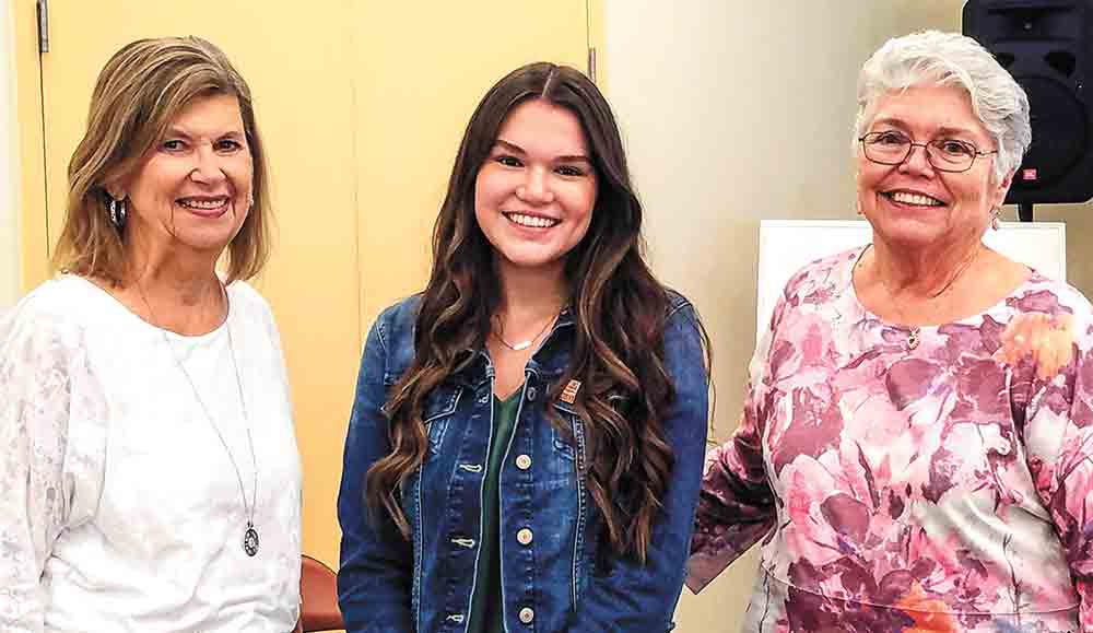 Livingston High School Senior Maci Hill won first place among 600,000 entries in the National History Day Competition with her documentary “Communist in the Cornfield: Roswell Garst’s Citizen Diplomacy.” Hill recently presented her documentary to the Polk County Chapter of the American Association of University Women (AAUW). (l-r) AAUW Member Jane Holcomb, Hill and AAUW Co-President Virginia Key. Photo by Emily Banks Wooten