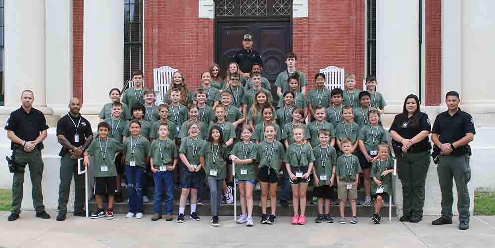 The Trinity County Sheriff’s Office Junior Deputy Program poses for a group photograph.
