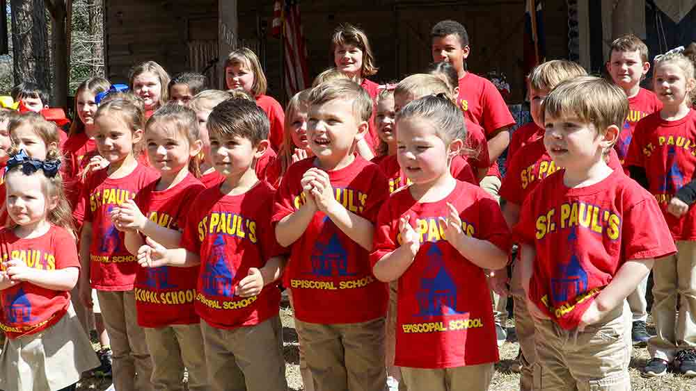 A group of St. Paul’s schoolchildren lead attendees in songs about Texas at last year’s Texas Independence Day celebration at Heritage Village. JIM POWERS | TCB FILE PHOTO