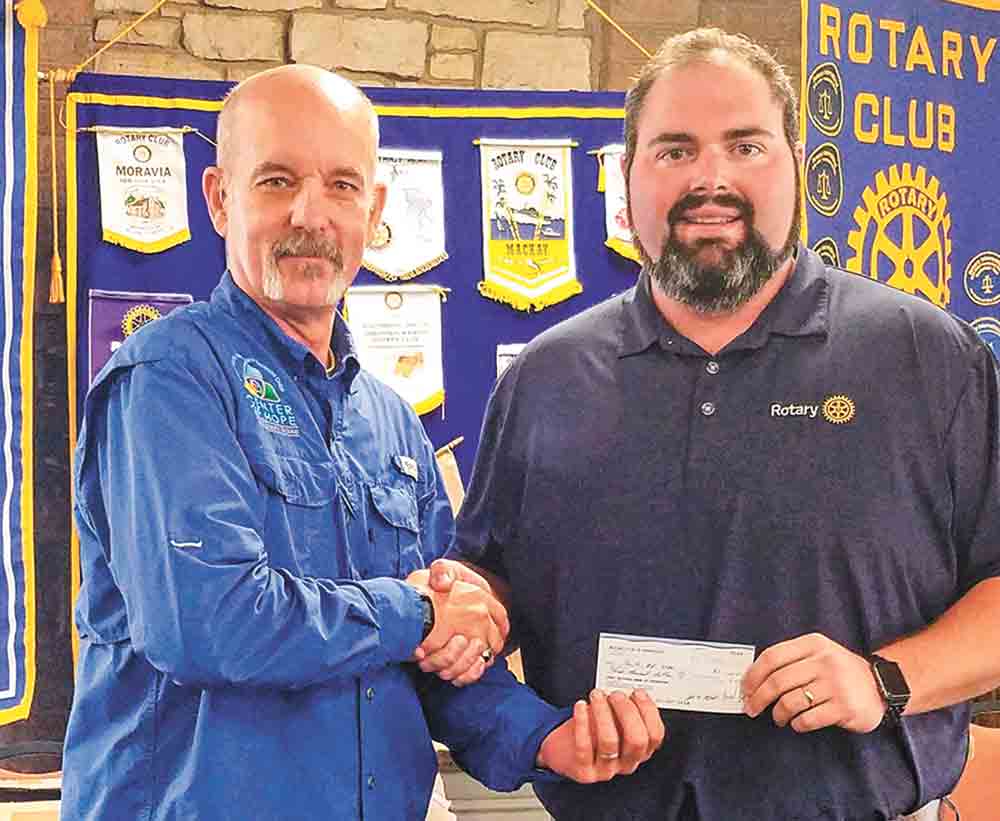 Rotary Club of Livingston President Andrew Boyce presents a check to Mike Fortney with Center of Hope following Fortney’s presentation to the local civic club recently. Photo by Emily Banks Wooten