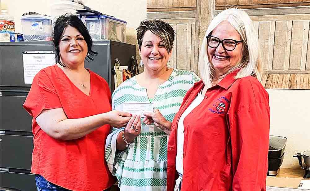 Trinity County 4-H clubs received donations for various projects. Pictured are Barbara Chamberlin, RWTC President, presenting Melissa Randall, 4-H Adult Leaders President, and Stacye Tullos, Trinity County Extension Agent, with a check during their Adult Leader meeting. 