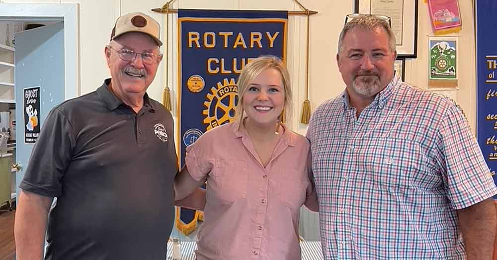 Pictured left-to-right: John Bradford and Taylor Bradford-Alvarez of Nacogdoches’ Front Porch Distillery are pictured with Woodville Rotary Club president John Wilson.  MOLLIE LASALLE | TCB