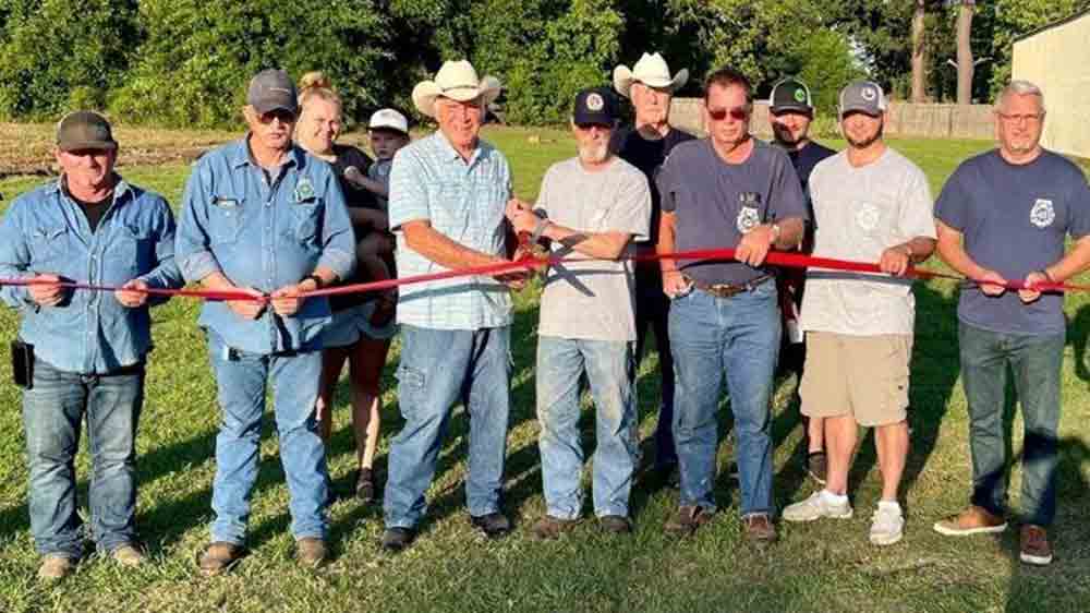 Spurger Volunteer Fire Department members cut the ribbon on the new land acquisition of 1.68 acres next to the fire station to expand its services. PHOTO COURTESY OF ROBIN GAIL WOOTEN
