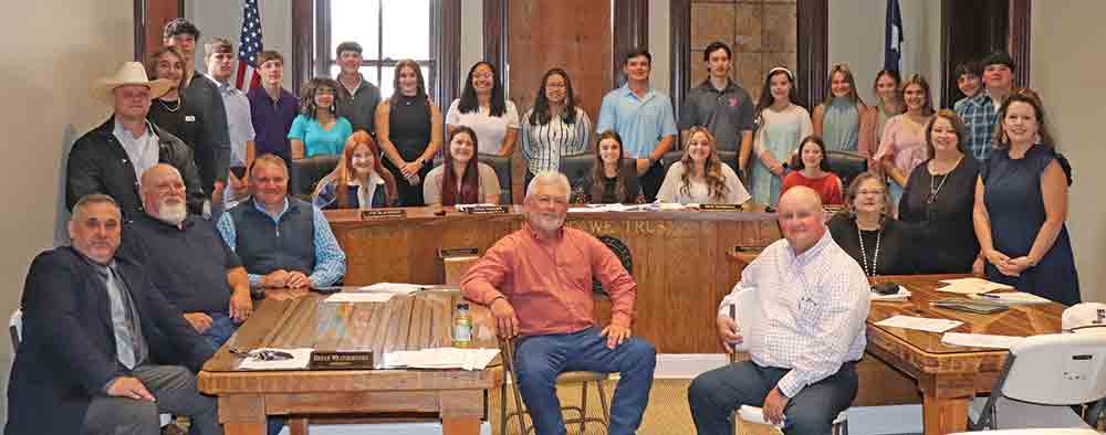 Students who were invited to participate in Monday’s “Local Government Day” pose with elected officials and county employees inside of the Tyler County Commissioners’ Courtroom. CHRIS EDWARDS | TCB
