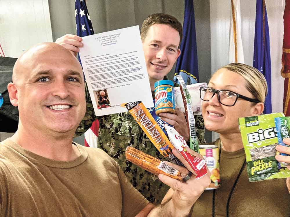 GRATITUDE DISPLAYED Volunteers with the Families And Individuals Thanking Heroes (F.A.I.T.H.) Military Support Group were pleased recently to receive this picture and email from some of the heroes who have received care packages from the group. The email said, “Good afternoon. Thank you for all the care packages you have sent! It means the world to us. There was a day last week where we were out working and missed breakfast and lunch. Those care packages came in handy so much that day! Thank you for your support.” Courtesy photo