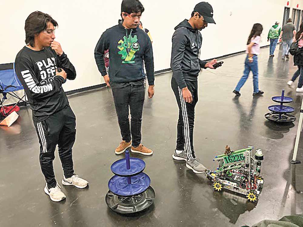 LHS Robotics teammates Oscar Vazquez, Juan Torres and Raqeeb Anjum preparing for competition.  Courtesy photo