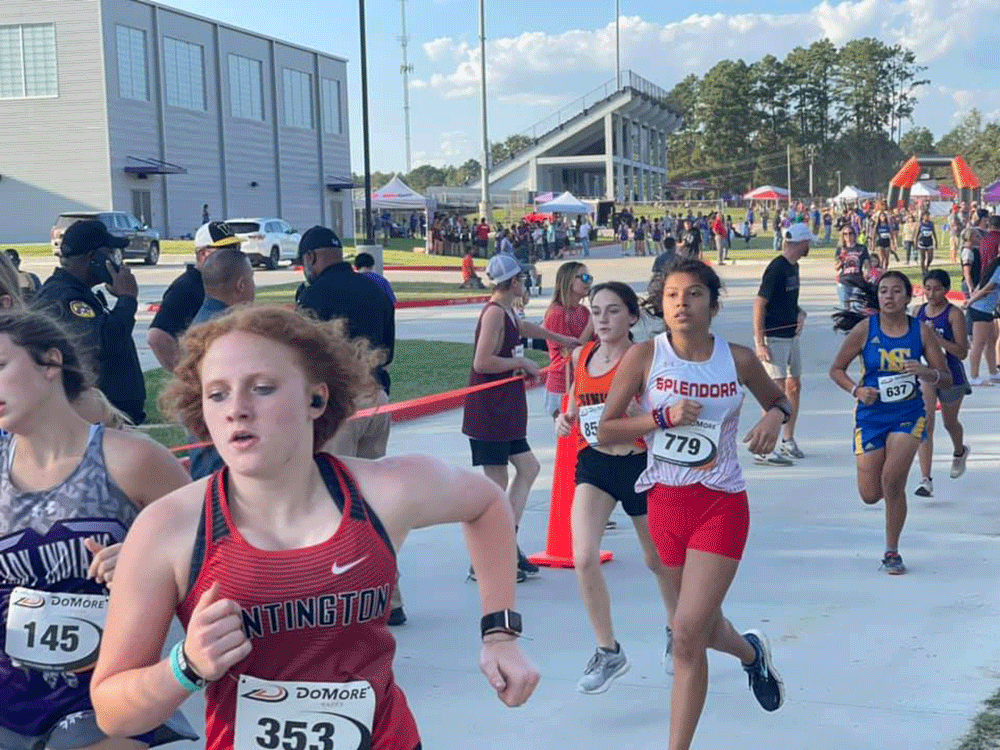 Trinity Lady Tiger Ava Morrison (center) takes off in the crowd during the Lufkin Coke Classic Invitational cross country meet. (Courtesy Photo)