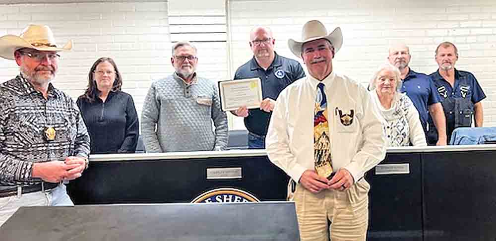 San Jacinto County Sheriff Greg Capers and Constable Ray Atchley present a certificate of appreciation to Mayor Charles Minton and members of the Shepherd City Council. Courtesy photo
