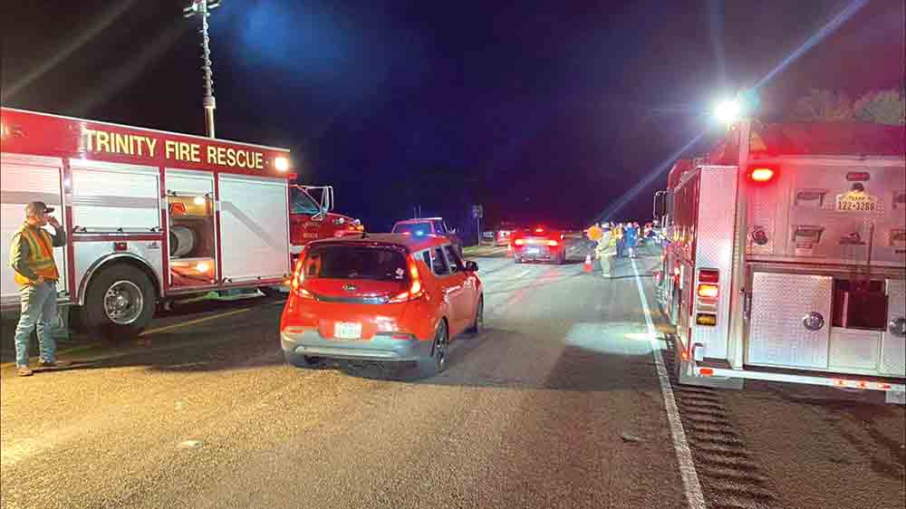 Trinity Fire & Rescue personnel assist law enforcement at an accident site. One person was injured in a two-car crash on Highway 19 Saturday evening. Courtesy photo