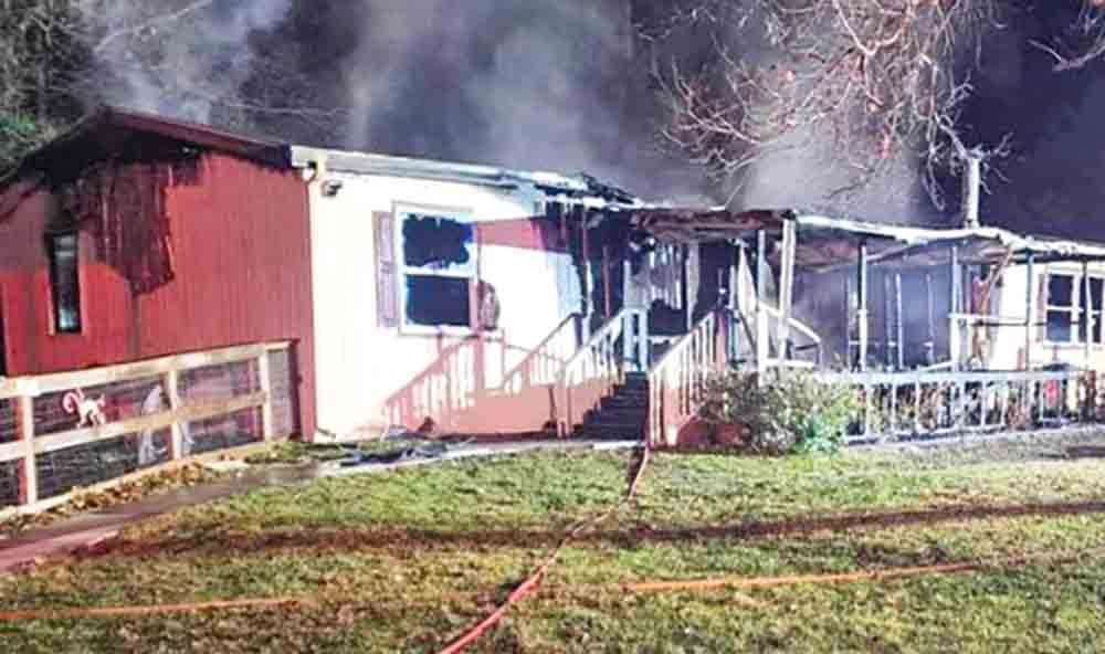 A double-wide mobile home burned down on Thursday in Trinity County.  Courtesy photo