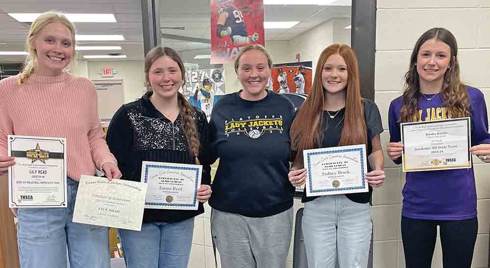 Volleyball players were honored at the Chester ISD board meeting on Monday. Pictured left-to-right:  Lily Read (All State outside hitter & THSCA super elite team member); Emma Byrd (All State honorable mention), coach Courtney Tonnies; Sidney Brock (All State honorable mention); Kinsley Barnes (Academic All State). BECKI BYRD | TCB