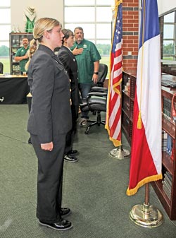 Tristan Hardy and Kathryne Griffin present the colors at the April board meeting. Courtesy photo
