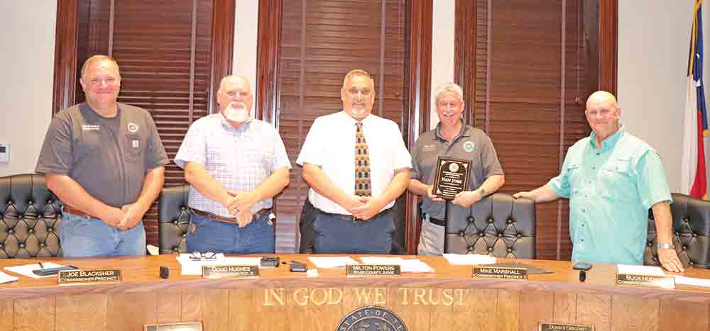 Outgoing Emergency Management Coordinator Ken Jobe (pictured second from right) was honored on Tuesday morning by the Tyler County Commissioners Court. Pictured with Jobe are (from left-to-right): Pct. 1 Commissioner Joe Blacksher; Pct. 2 Commissioner Doug Hughes; Tyler County Judge Milton Powers and Pct. 4 Commissioner Buck Hudson. CHRIS EDWARDS | TCB