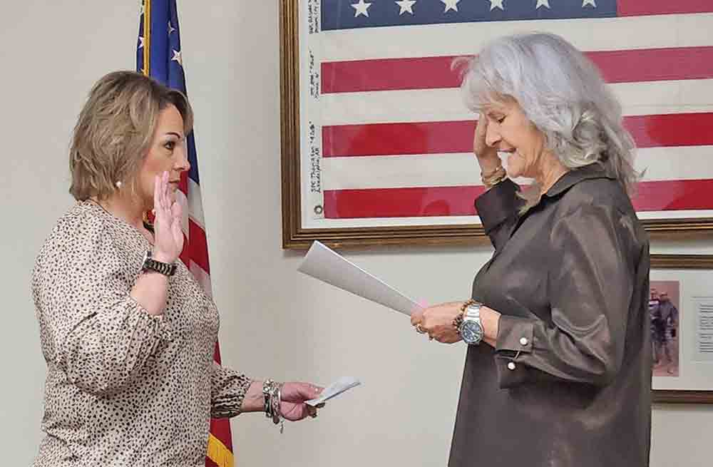 County Judge Sydney Murphy administered the oath of office to Tatum White, the newly elected county tax assessor-collector, following the Polk County Commissioners Court meeting Tuesday. White will take office effective May 1. Photo by Emily Banks Wooten